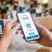 Hands holding smartphone while scanning a Zapper QR code